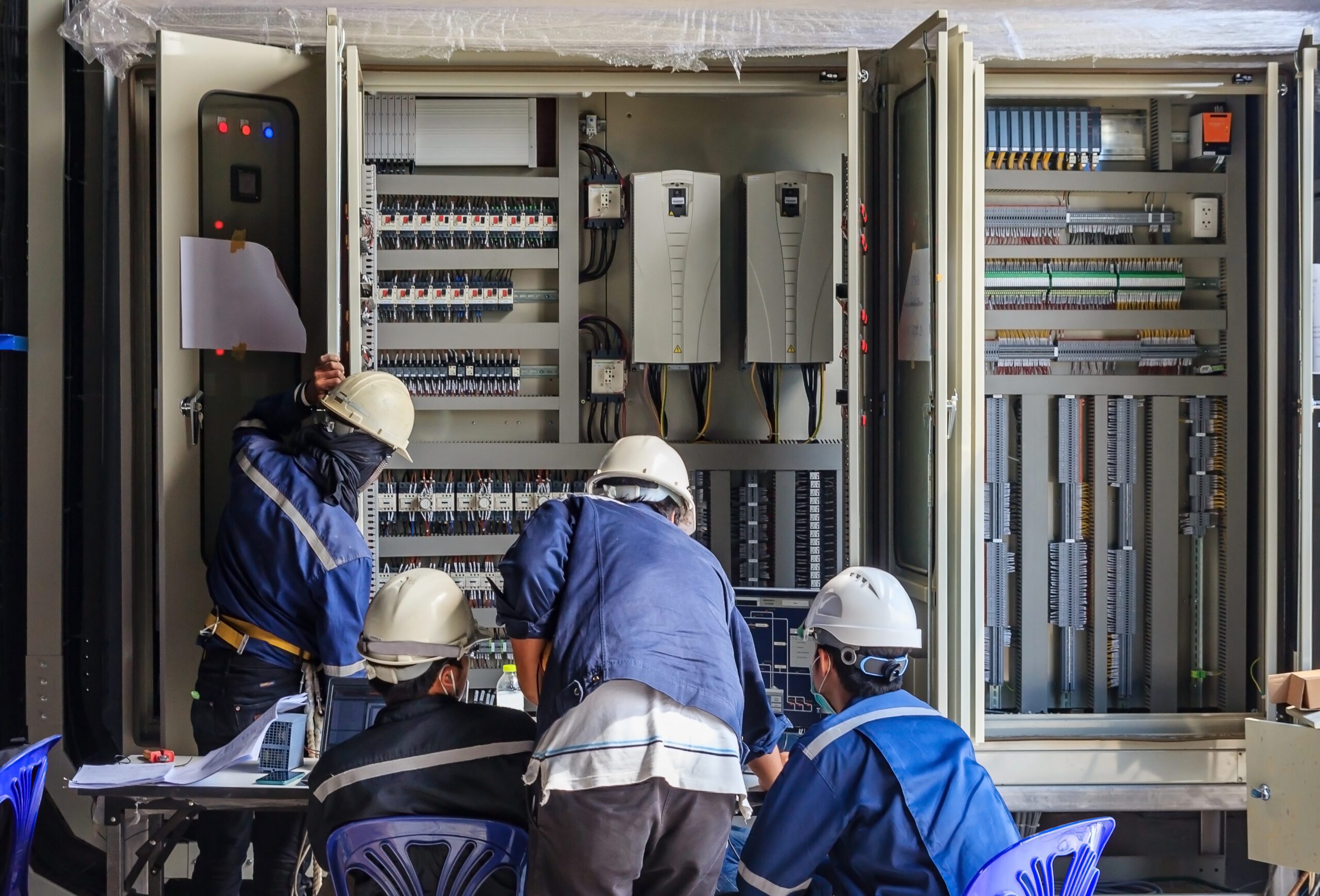 Equipment technicians who are integrating the control panels for processing equipment.