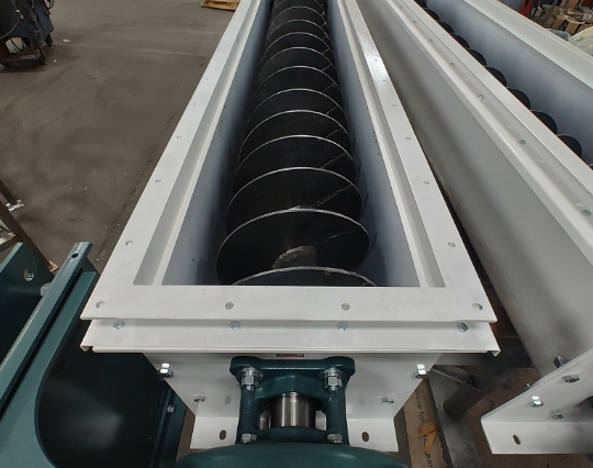 Feed Mill Screw Conveyor Screw conveyor in a feed mill.